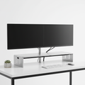 Dual monitor stand with two screens on a desk